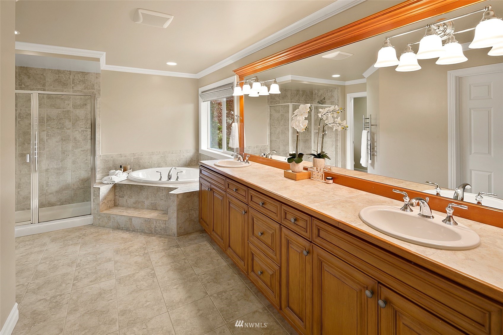 4202 221st Place Southeast Bothell, WA 98021 - Photo 14 of 28 a spacious bathroom with a double vanity sink mirror and a bathtub