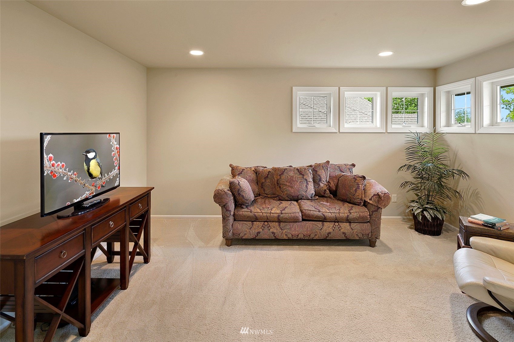 4202 221st Place Southeast Bothell, WA 98021 - Photo 20 of 28 a living room with furniture and a flat screen tv