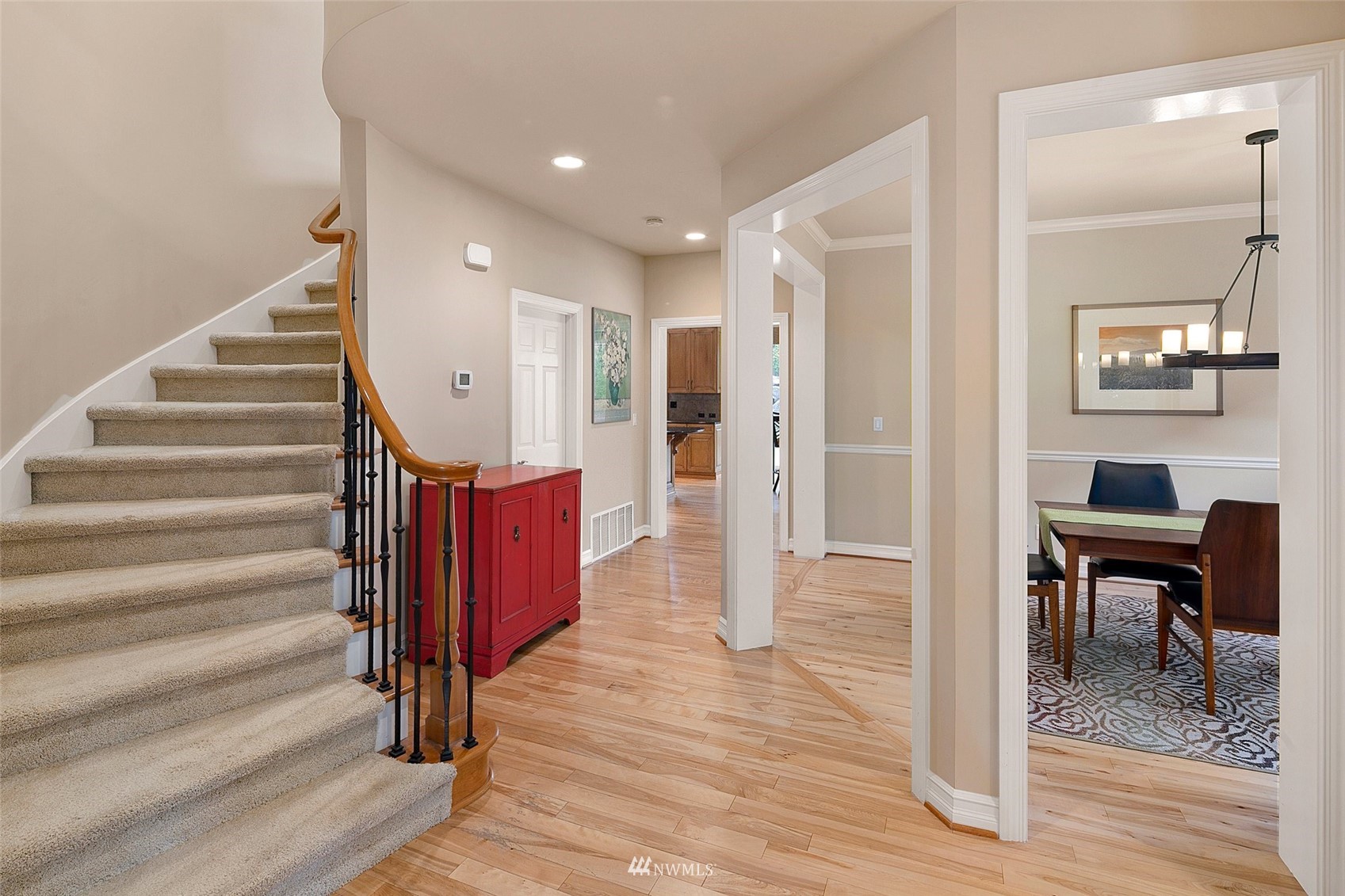 4202 221st Place Southeast Bothell, WA 98021 - Photo 3 of 28 a view of a hallway with wooden floor and staircase