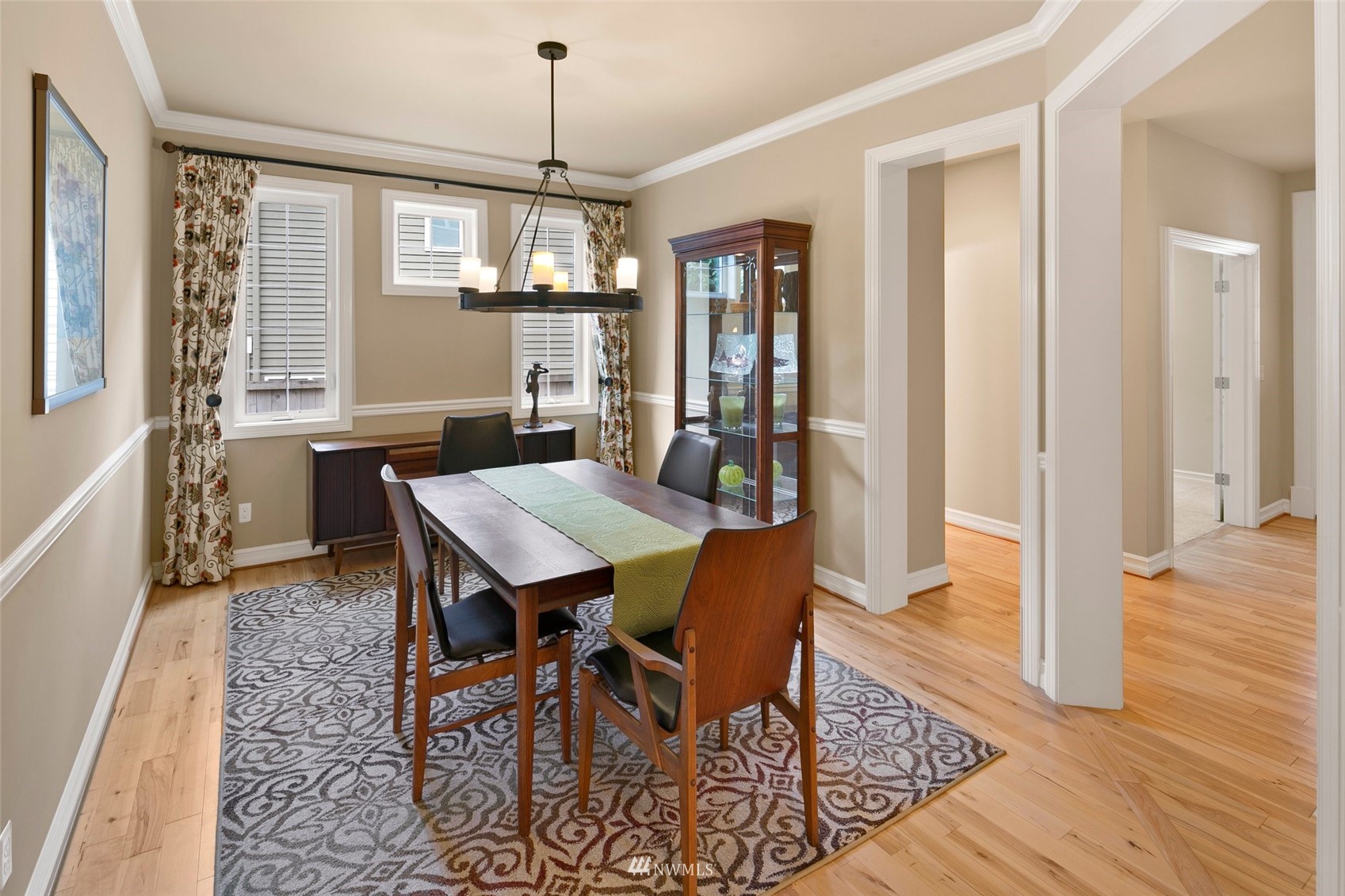 4202 221st Place Southeast Bothell, WA 98021 - Photo 5 of 28 a view of a dining room with furniture window and wooden floor