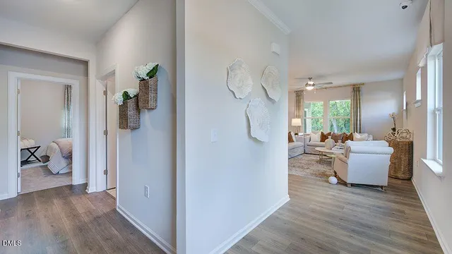 a kitchen with a table chairs sink and cabinets