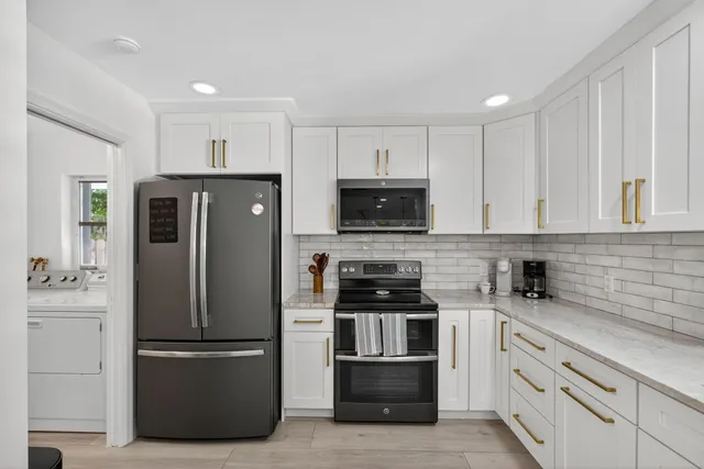 a kitchen with a sink and potted plant