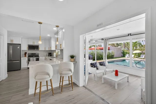 a bedroom with a bed and glass window
