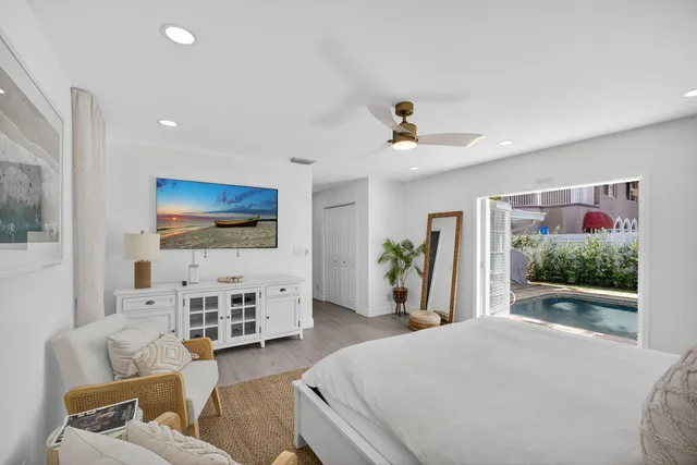 a spacious bathroom with a granite countertop sink a toilet and a bathtub