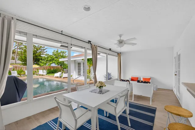 a front view of house with yard and outdoor seating