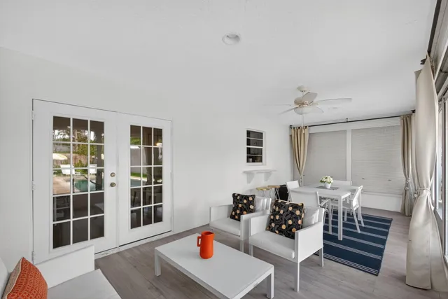 an aerial view of a house with swimming pool and porch