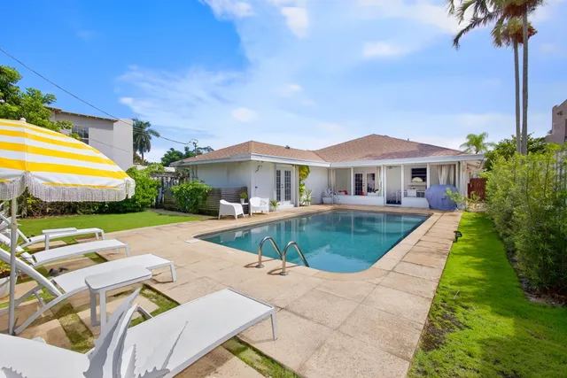 a view of a swimming pool with a patio