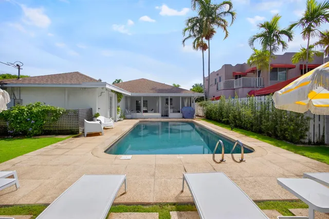 an aerial view of a house with a garden