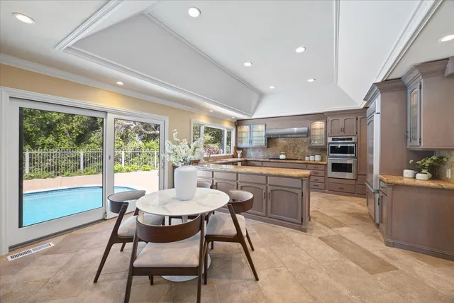 a spacious bedroom with two beds and a window