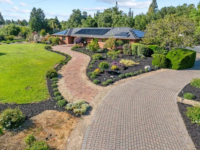 an aerial view of a house with swimming pool