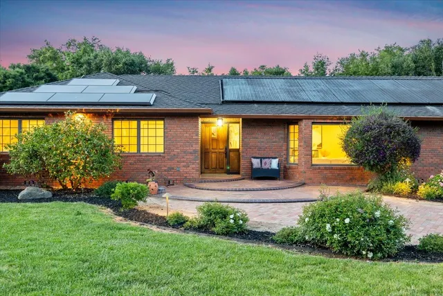 a living room with furniture a rug and a fireplace