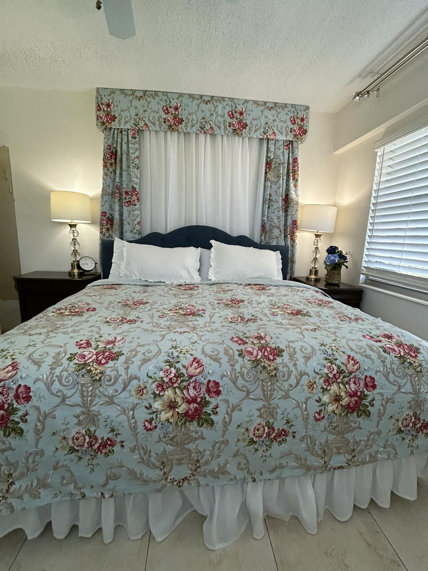 243 Suffolk F Boca Raton, FL 33434 - Photo 9 of 12 a bedroom with a bed and a dresser