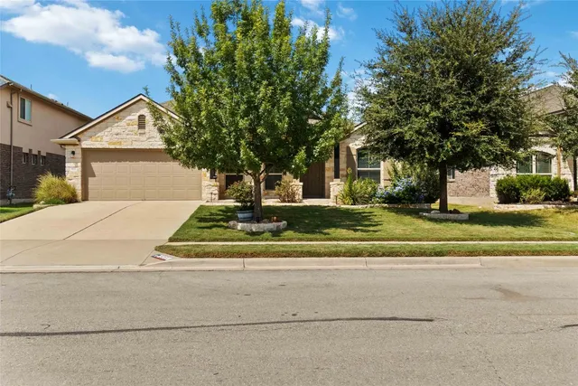 a house with trees in the background