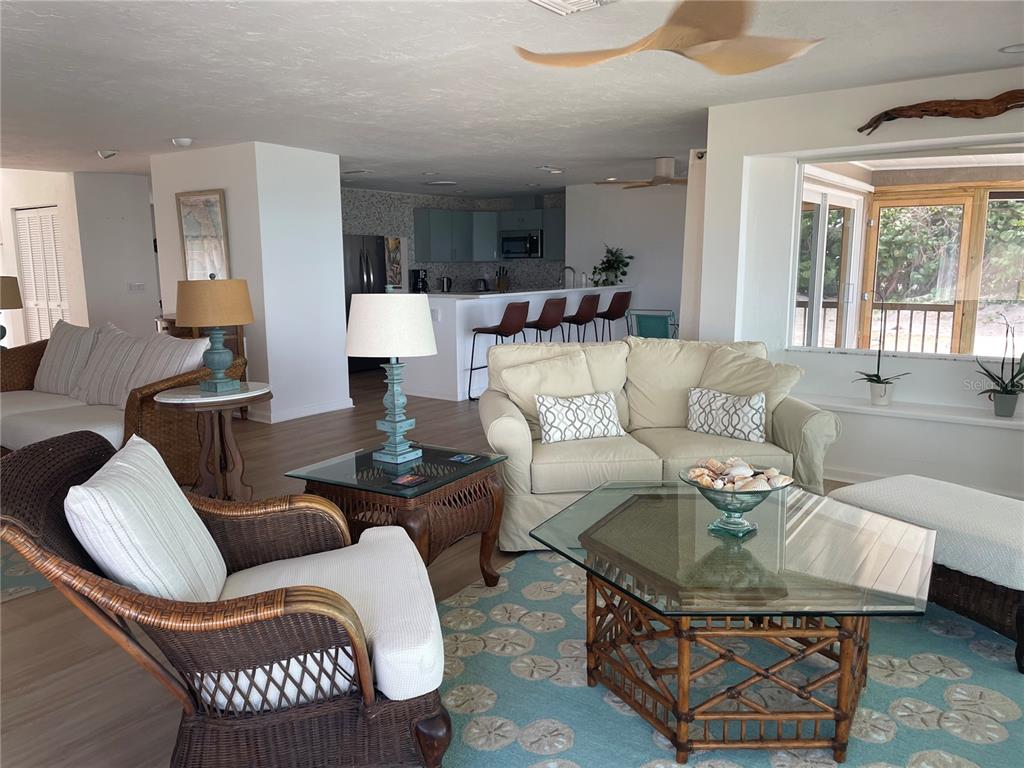 2709 Casey Key Road Nokomis, FL 34275 - Photo 12 of 64 a living room with furniture and a large window
