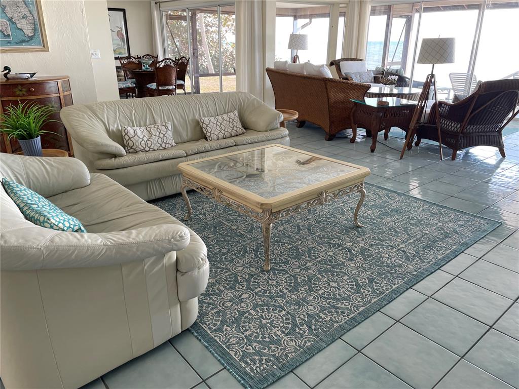 2709 Casey Key Road Nokomis, FL 34275 - Photo 13 of 40 a living room with furniture and a large window