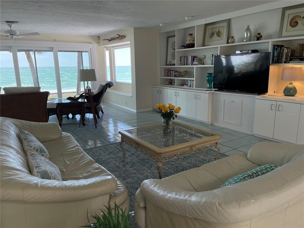 2709 Casey Key Road Nokomis, FL 34275 - Photo 14 of 40 a living room with furniture and a flat screen tv