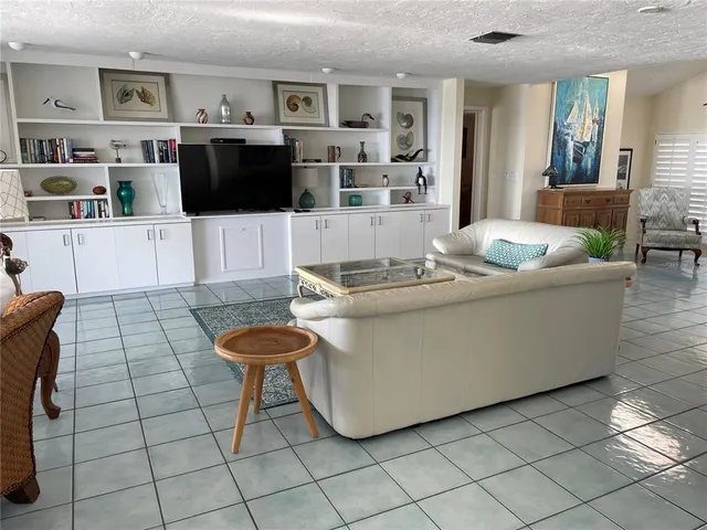 a reading room with furniture and window