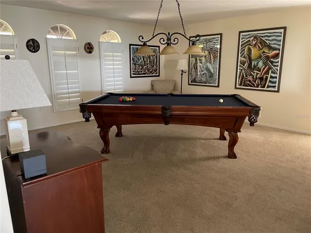 a kitchen with cabinets stainless steel appliances and a sink