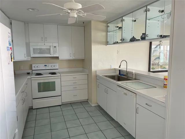 a bathroom with a sink vanity and mirror