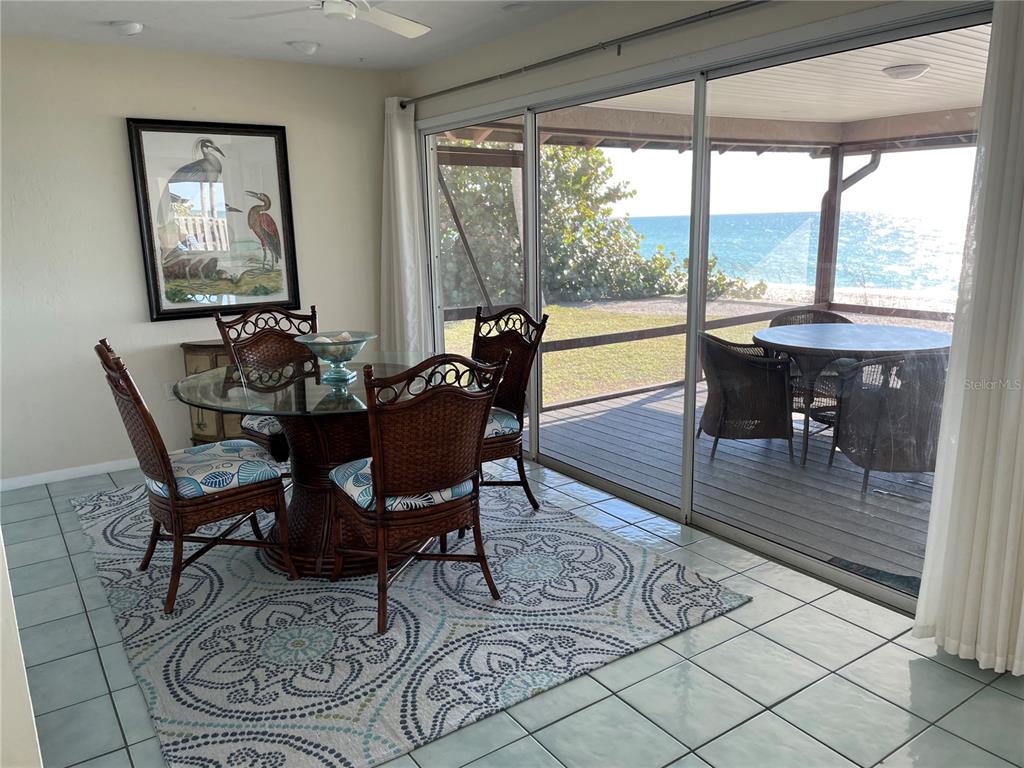 2709 Casey Key Road Nokomis, FL 34275 - Photo 20 of 40 a view of a dining room with furniture window and outside view
