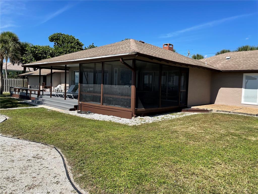 2709 Casey Key Road Nokomis, FL 34275 - Photo 2 of 40 a front view of a house with a yard