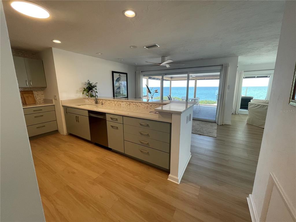 2709 Casey Key Road Nokomis, FL 34275 - Photo 21 of 64 a kitchen with stainless steel appliances granite countertop a sink stove and refrigerator