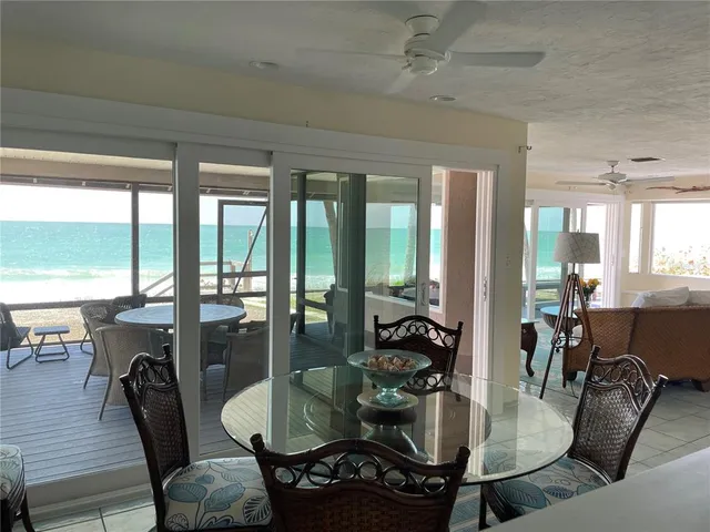 a bedroom with a bed and painting on the wall