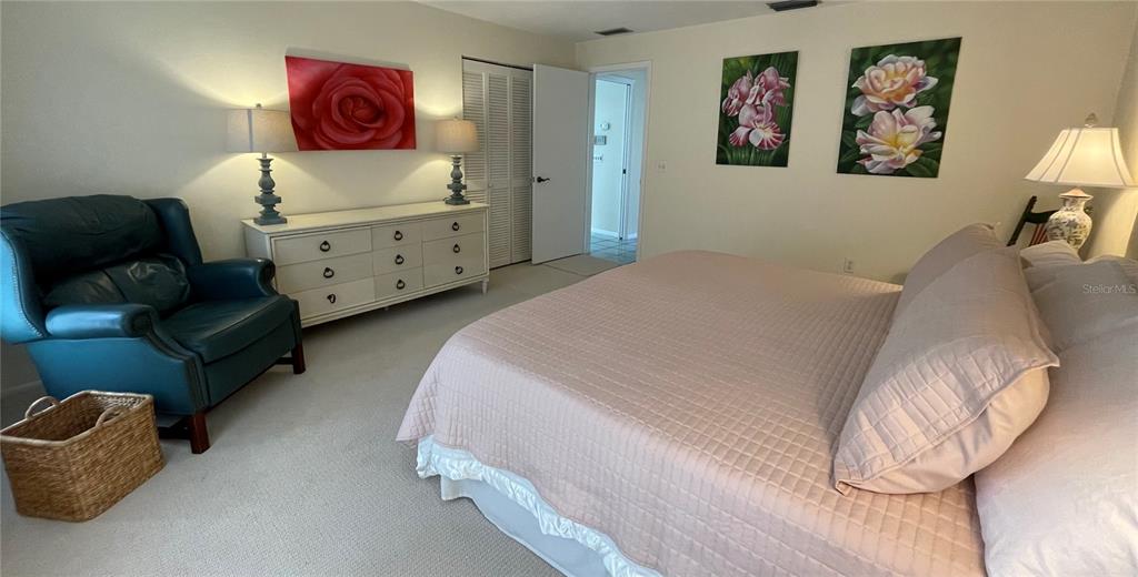 2709 Casey Key Road Nokomis, FL 34275 - Photo 35 of 40 a bedroom with a bed and furniture