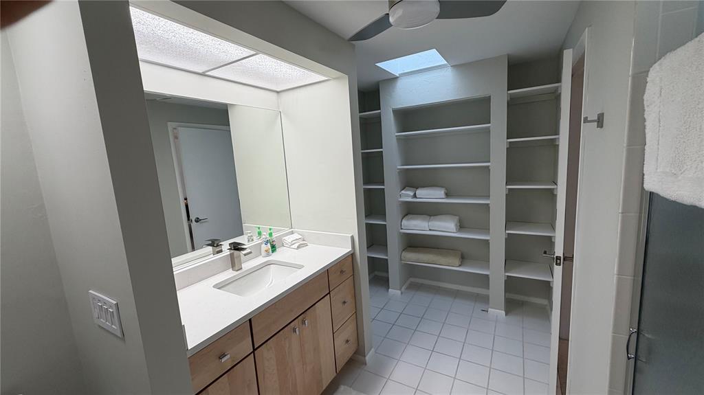 2709 Casey Key Road Nokomis, FL 34275 - Photo 36 of 64 a bathroom with a sink vanity and a mirror
