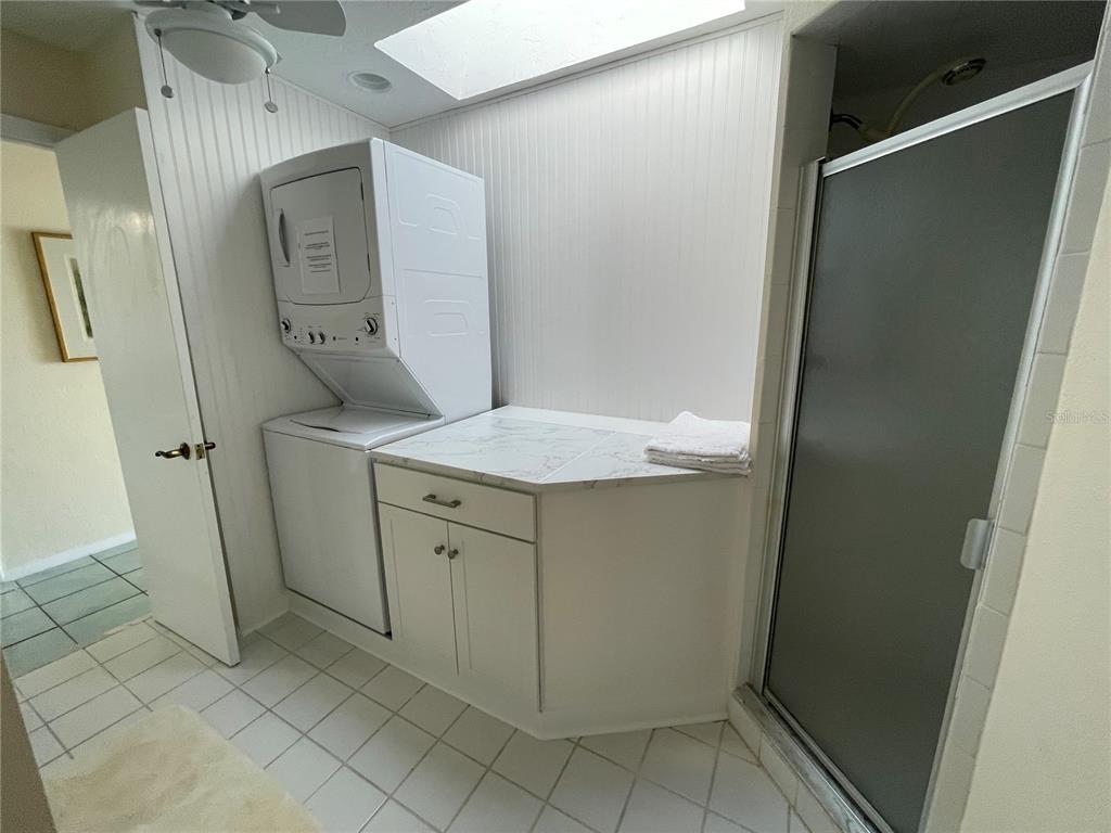 2709 Casey Key Road Nokomis, FL 34275 - Photo 38 of 40 a bathroom with a granite countertop sink and a mirror