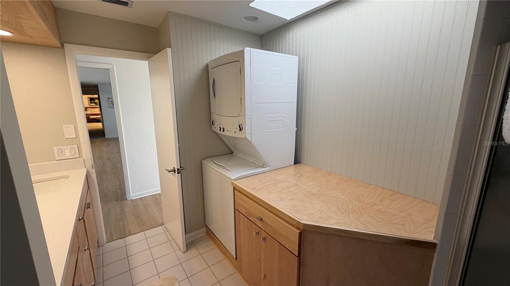 2709 Casey Key Road Nokomis, FL 34275 - Photo 47 of 64 a utility room with a sink washer and dryer