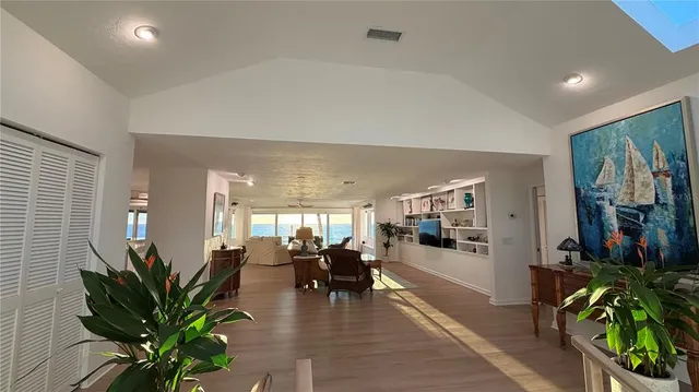 a kitchen with granite countertop a sink and a refrigerator