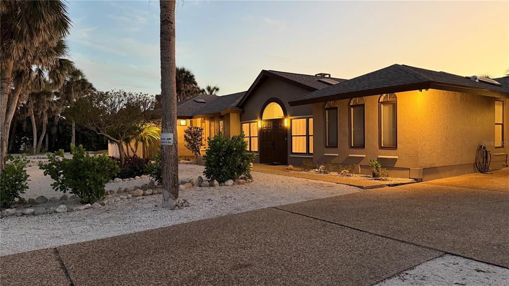 2709 Casey Key Road Nokomis, FL 34275 - Photo 64 of 64 a front view of a house with a yard