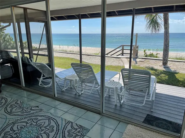 a view of a balcony with furniture