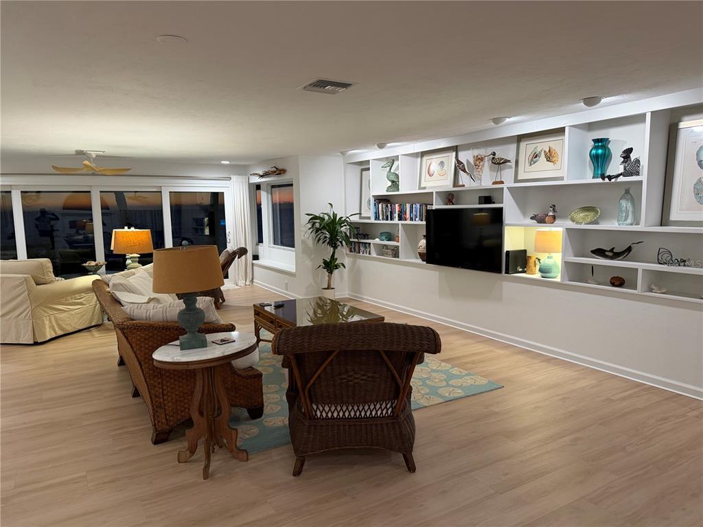 2709 Casey Key Road Nokomis, FL 34275 - Photo 9 of 64 a living room with furniture and a flat screen tv