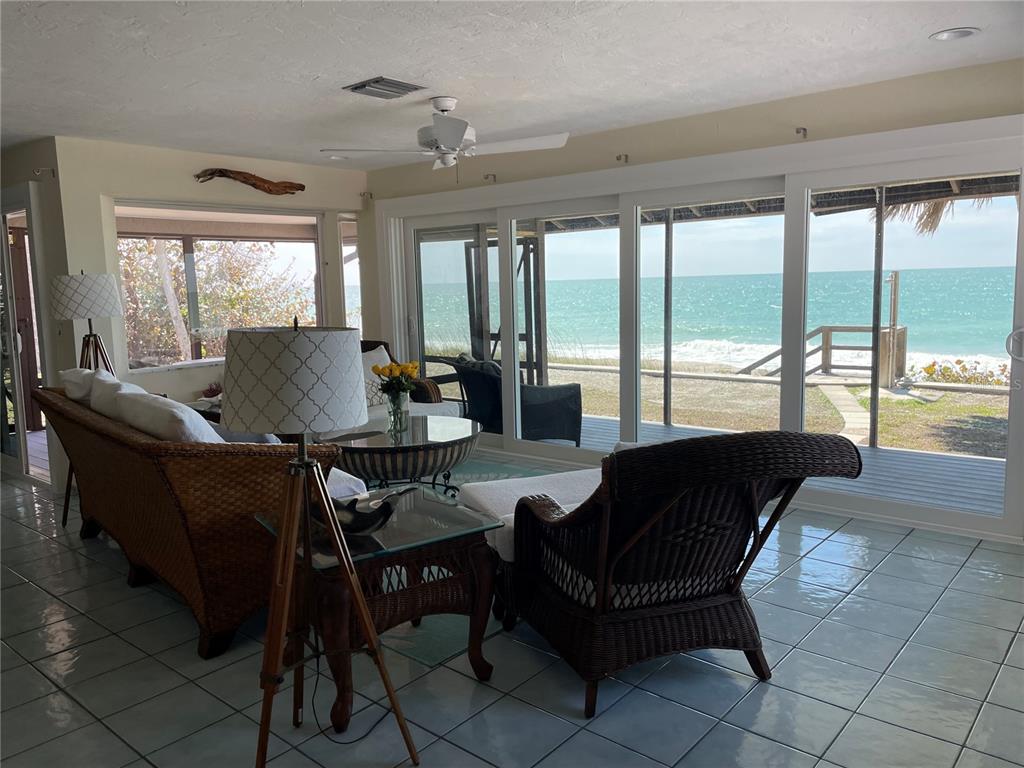 2709 Casey Key Road Nokomis, FL 34275 - Photo 10 of 40 a living room with furniture and a large window