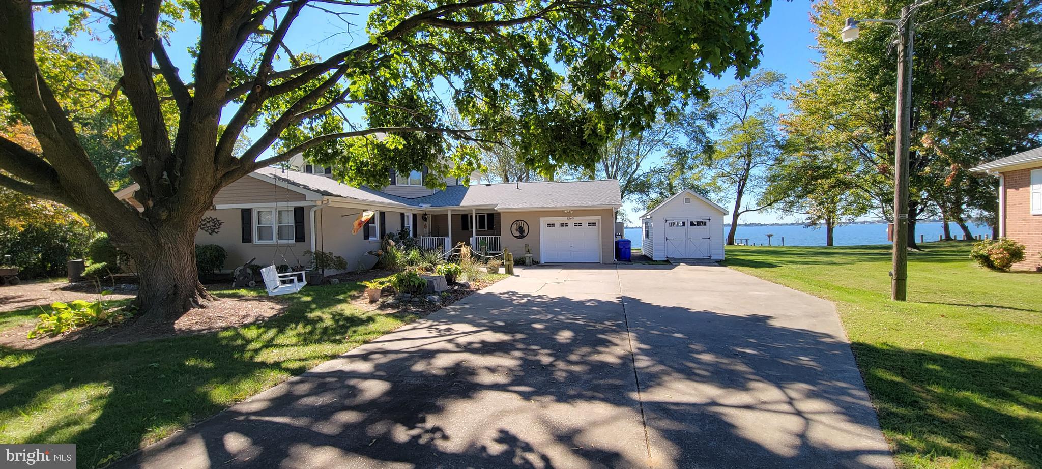 1360 Calvert Road Chester, MD 21619 - Photo 38 of 66 a front view of a house with a yard and a garden