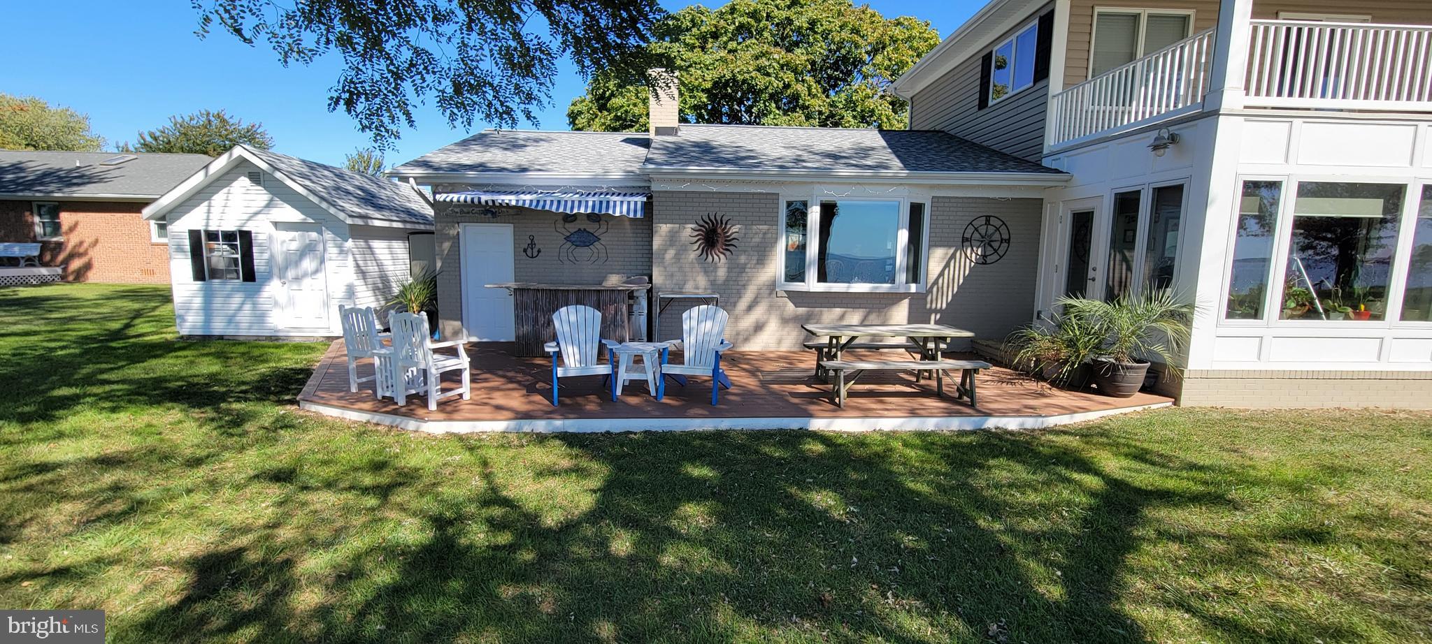 1360 Calvert Road Chester, MD 21619 - Photo 4 of 66 a view of a house with backyard porch and sitting area