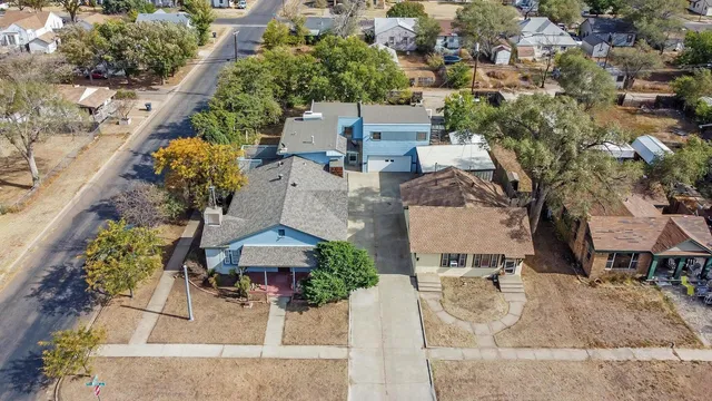 an aerial view of residential houses with outdoor space