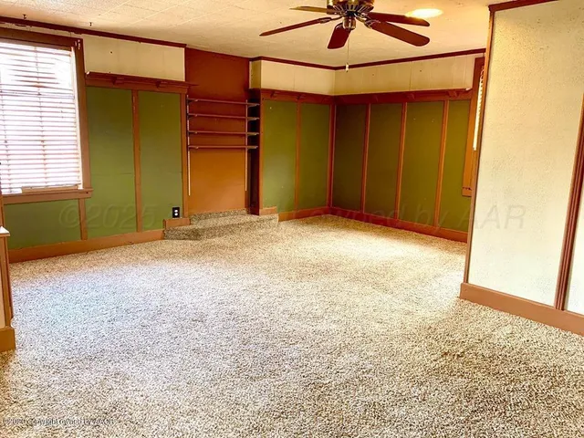 a view of empty room with a window