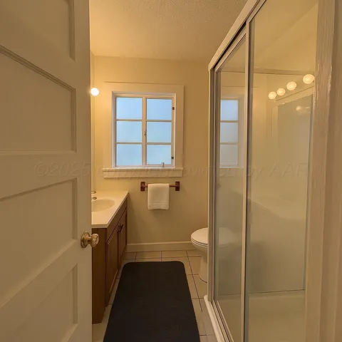 a bathroom with a bathtub and shower