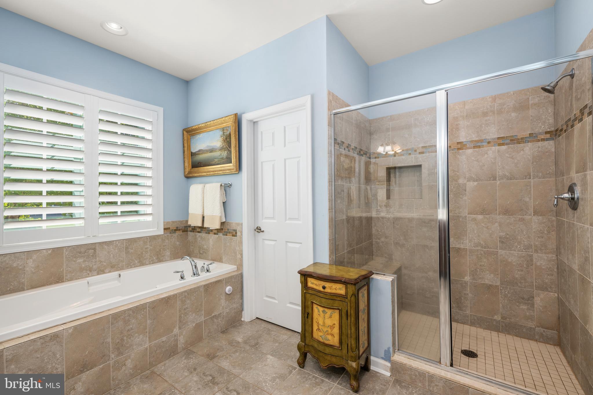 16624 Shoal Road Lewes, DE 19958 - Photo 27 of 67 Primary Bath with walk-in shower and linen closet