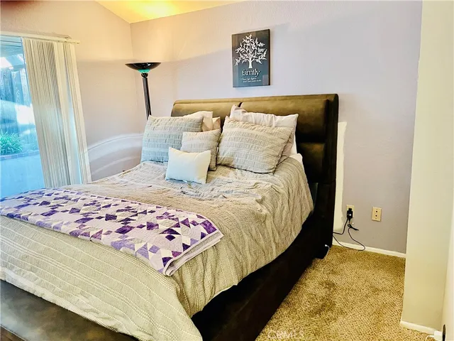 a view of a patio with a table and chairs