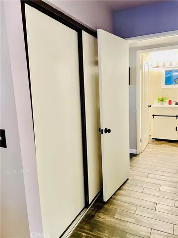 a bedroom with a bed and a table in it