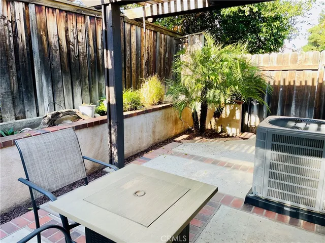 a dining room with furniture and a window