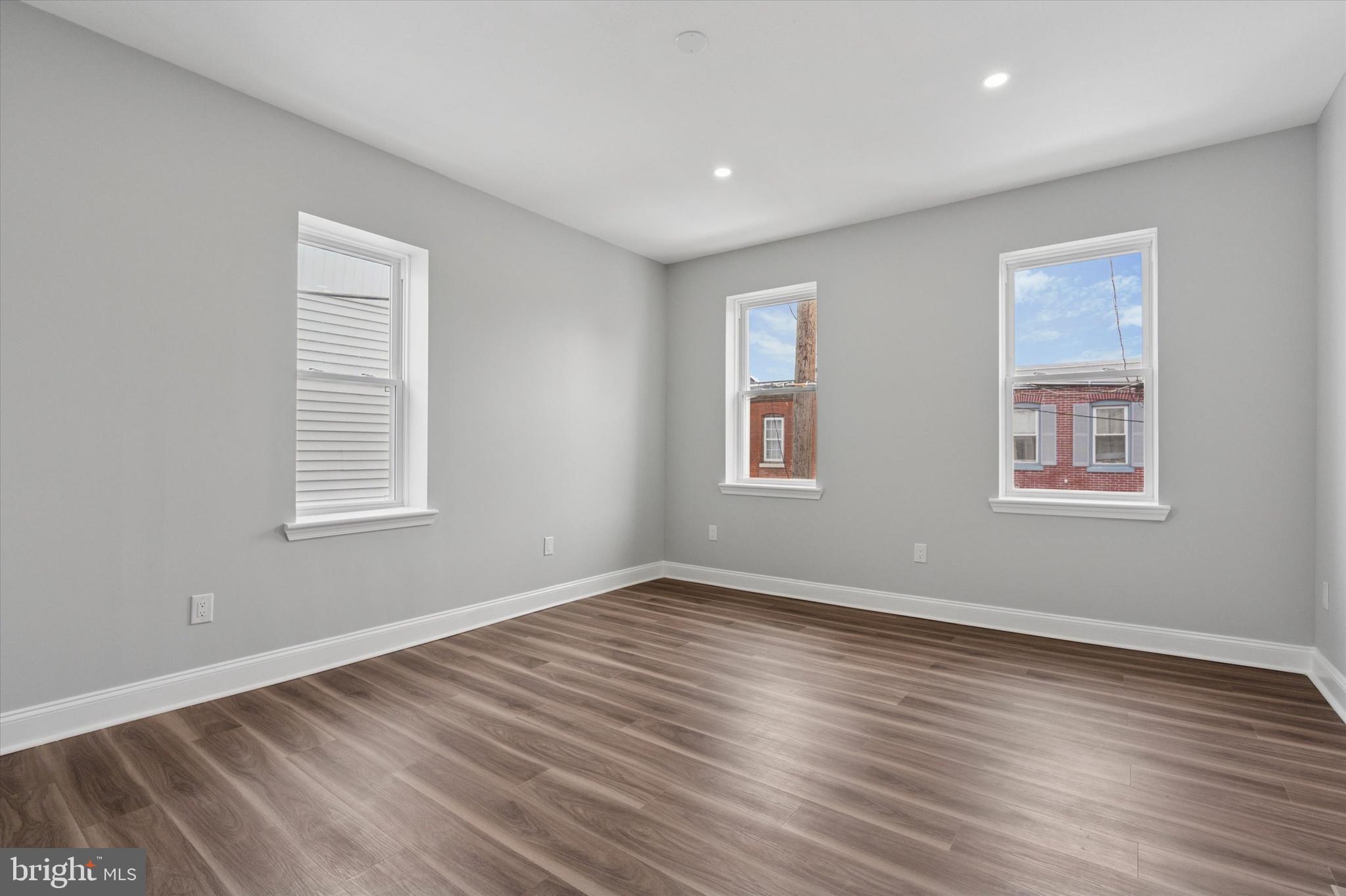 3448 Amber Street Philadelphia, PA 19134 - Photo 18 of 29 a view of empty room with wooden floor and fan