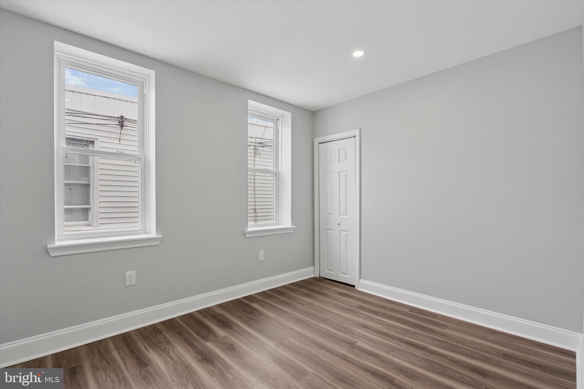 3448 Amber Street Philadelphia, PA 19134 - Photo 21 of 29 an empty room with wooden floor and windows