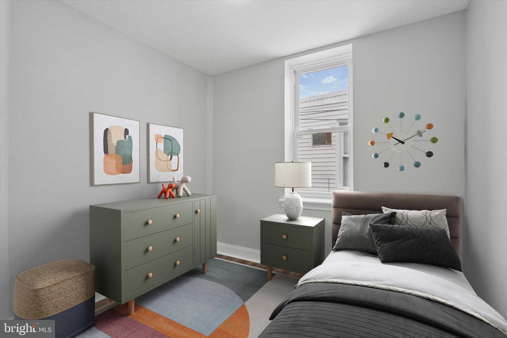 3448 Amber Street Philadelphia, PA 19134 - Photo 23 of 29 a bedroom with furniture and a window