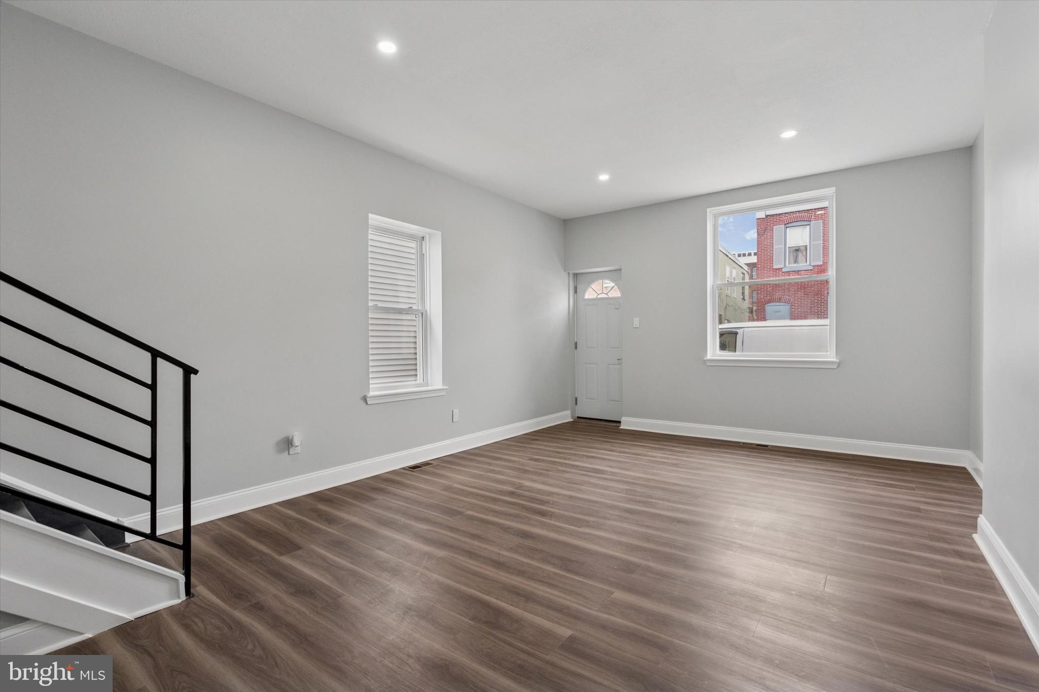 3448 Amber Street Philadelphia, PA 19134 - Photo 4 of 29 an empty room with wooden floor and windows