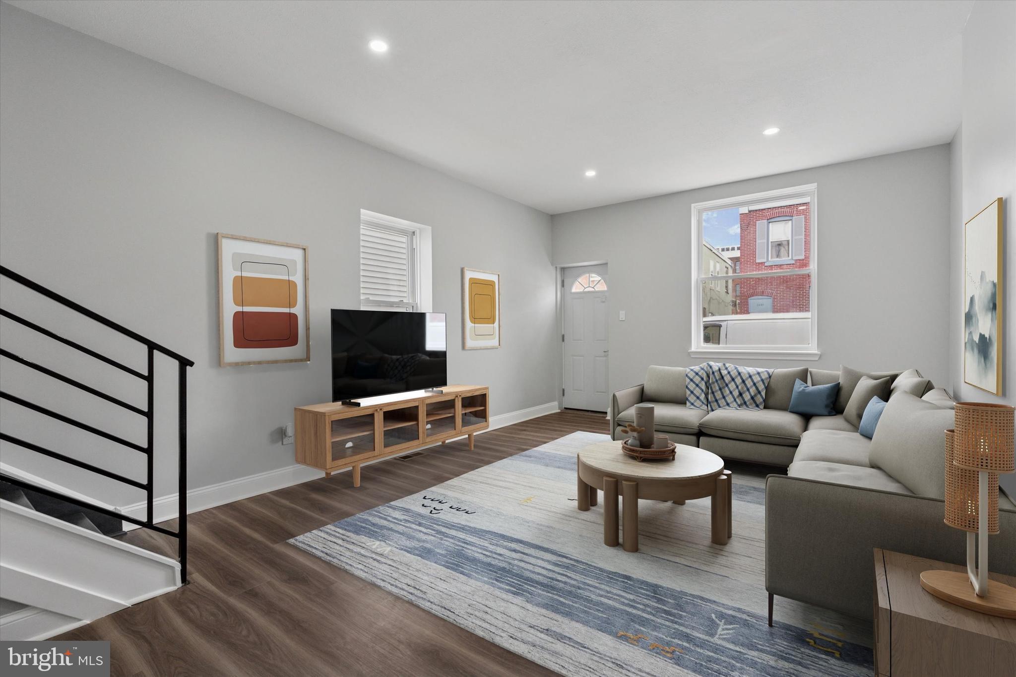 3448 Amber Street Philadelphia, PA 19134 - Photo 6 of 29 a living room with furniture and a flat screen tv